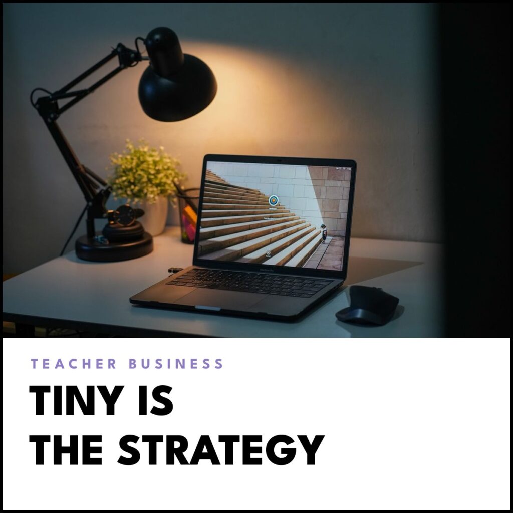 A laptop on a cozy home desk under a warm lamp in the evening, with the headline 'Tiny is the strategy'